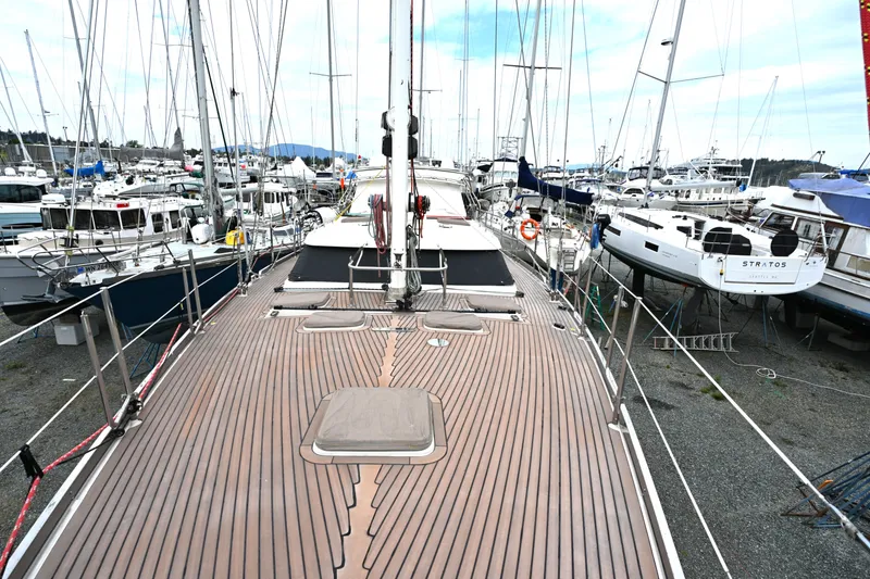 Slide: The Image of Deck view of a 2006 Waterline 50 yacht in a busy marina. - 10