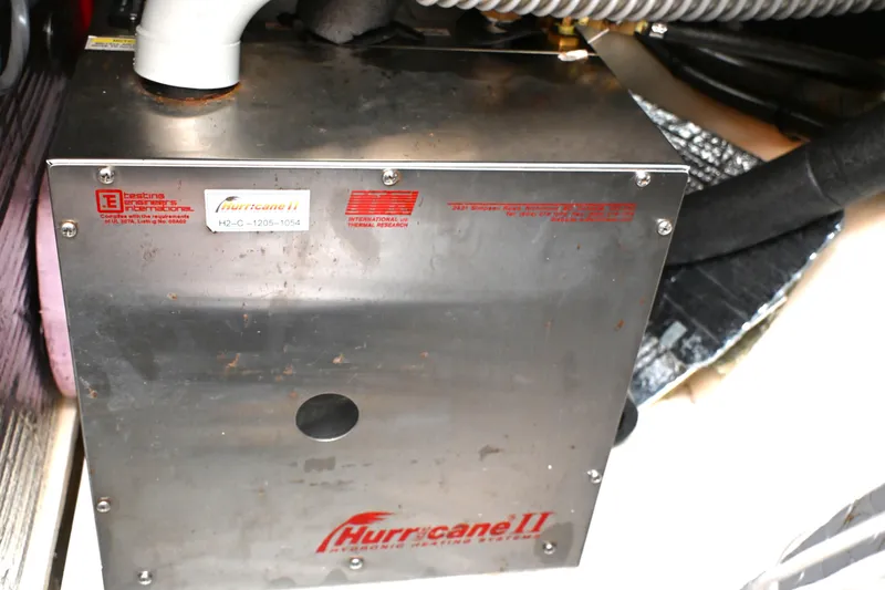 Slide: The Image of Hurricane II heating system in a 2006 Waterline 50 boat engine room. - 103