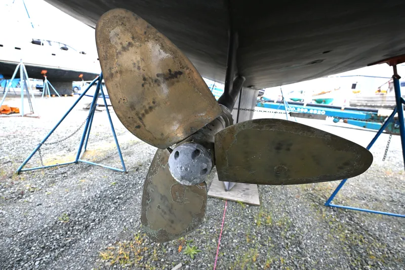 Slide: The Image of Close-up of a 2006 Waterline 50 boat propeller in a shipyard. - 116