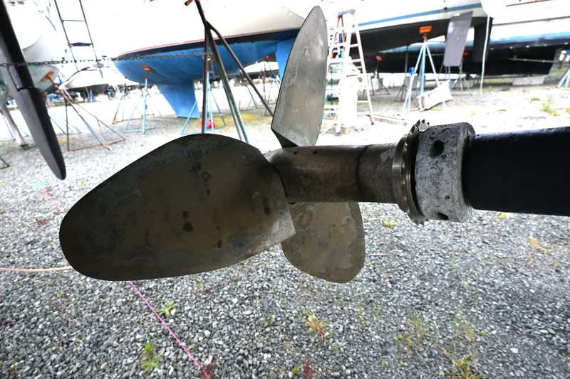 Slide: The Image of Close-up of a 2006 Waterline 50 boat propeller in a shipyard. - 117