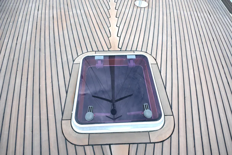 Slide: The Image of Teak deck of 2006 Waterline 50 yacht with a central hatch. - 16