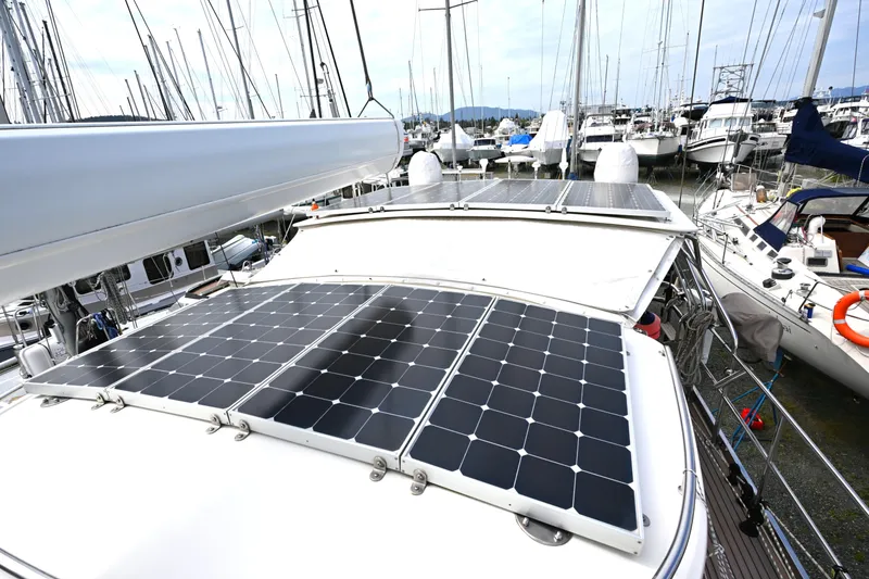 Slide: The Image of Sailboat with solar panels docked at marina, Waterline 50 model, 2006. - 19