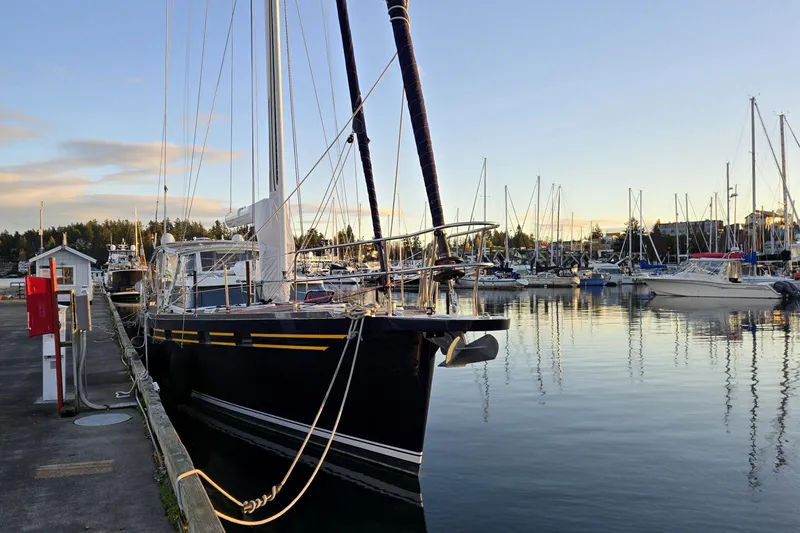 Slide: The Image of Sailboat docked at marina, Waterline 50 model, 2006, during sunset. - 2