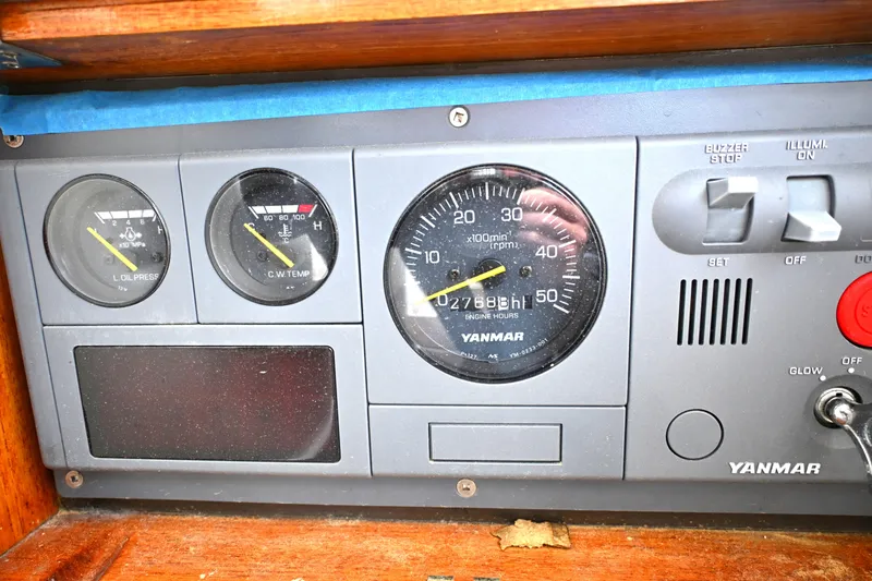 Slide: The Image of Yanmar engine control panel on a 2006 Waterline 50 boat, displaying gauges and switches. - 34