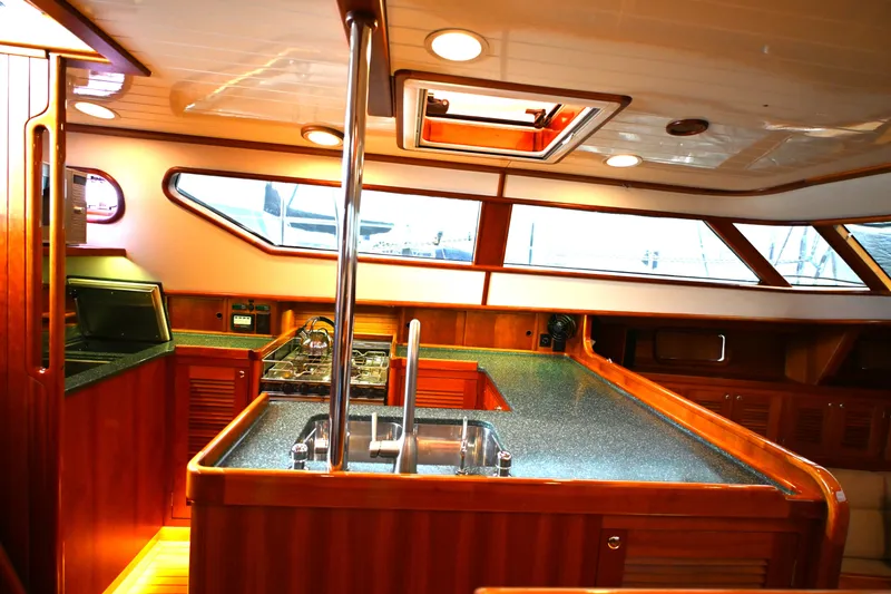 Slide: The Image of Luxurious 2006 Waterline 50 yacht interior with modern kitchen and sleek wood finishes. - 38