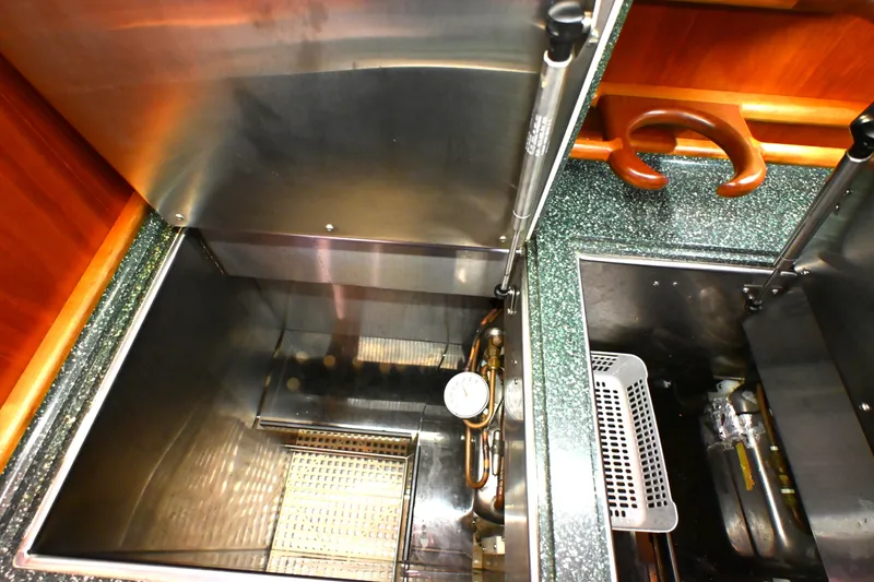 Slide: The Image of Interior view of a 2006 Waterline 50 yacht kitchen with stainless steel appliances. - 39