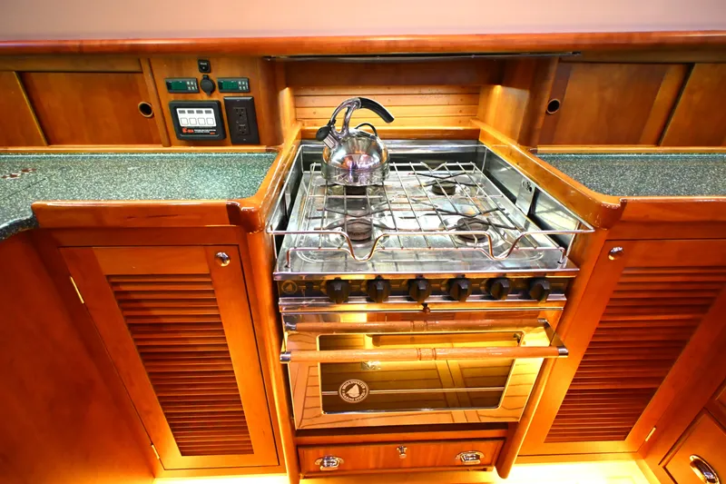 Slide: The Image of Wooden yacht kitchen with stove and kettle, Waterline 50, 2006 model. - 42