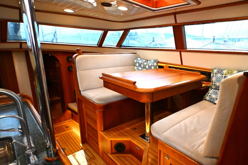 Slide: The Image of Luxurious interior of a 2006 Waterline 50 yacht with elegant wood finishes and plush seating. - 44