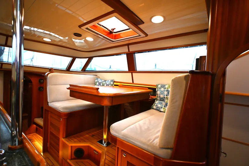 Slide: The Image of Luxurious interior of a 2006 Waterline 50 yacht with elegant wood finishes and plush seating. - 45
