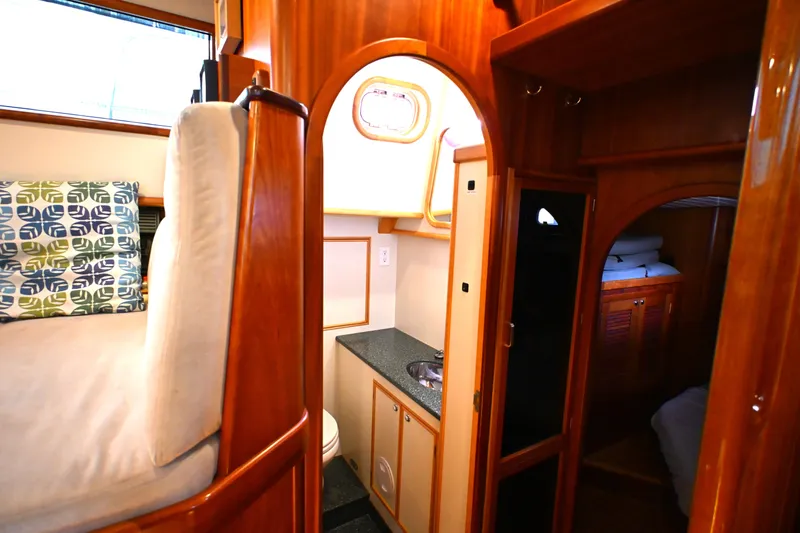 Slide: The Image of Interior of 2006 Waterline 50 yacht with cozy wooden furnishings and compact amenities. - 46