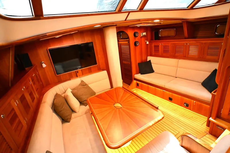Slide: The Image of Luxurious interior of 2006 Waterline 50 yacht with elegant wood finish and cozy seating. - 55