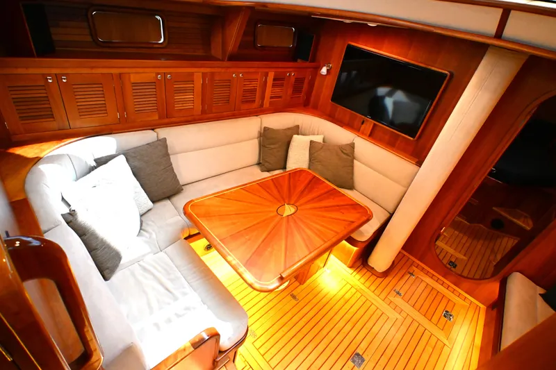Slide: The Image of Luxurious interior of 2006 Waterline 50 yacht with cozy seating and elegant wood finishes. - 56