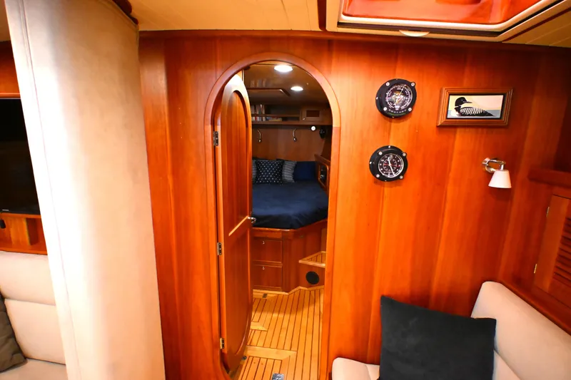 Slide: The Image of Luxurious 2006 Waterline 50 yacht interior with wooden finish and cozy cabin view. - 60