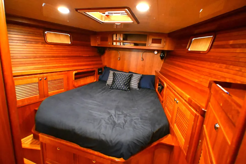 Slide: The Image of Luxurious wooden cabin interior of 2006 Waterline 50 yacht with cozy bed and ambient lighting. - 62