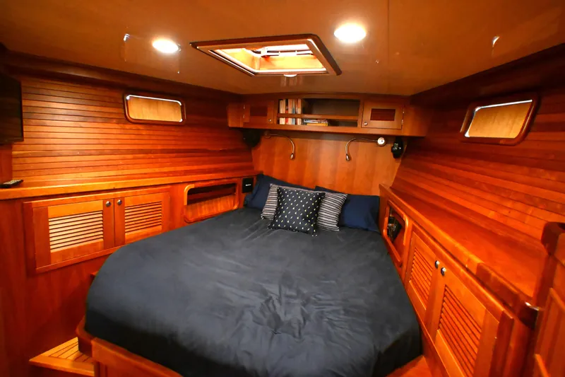 Slide: The Image of Luxurious wooden cabin interior of 2006 Waterline 50 yacht with cozy bedding. - 63