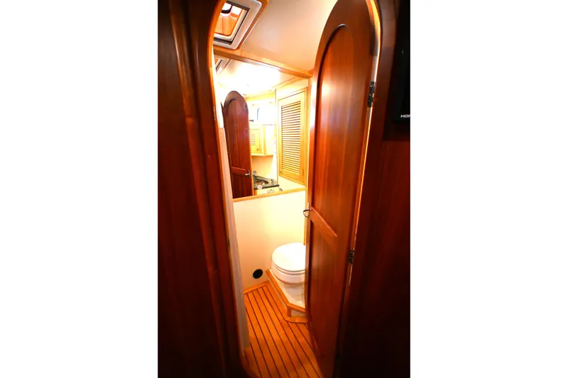 Slide: The Image of Interior view of a 2006 Waterline 50 yacht bathroom with wooden finishes. - 65