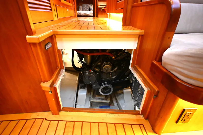Slide: The Image of Engine compartment of a 2006 Waterline 50 yacht, featuring wooden interior design. - 74