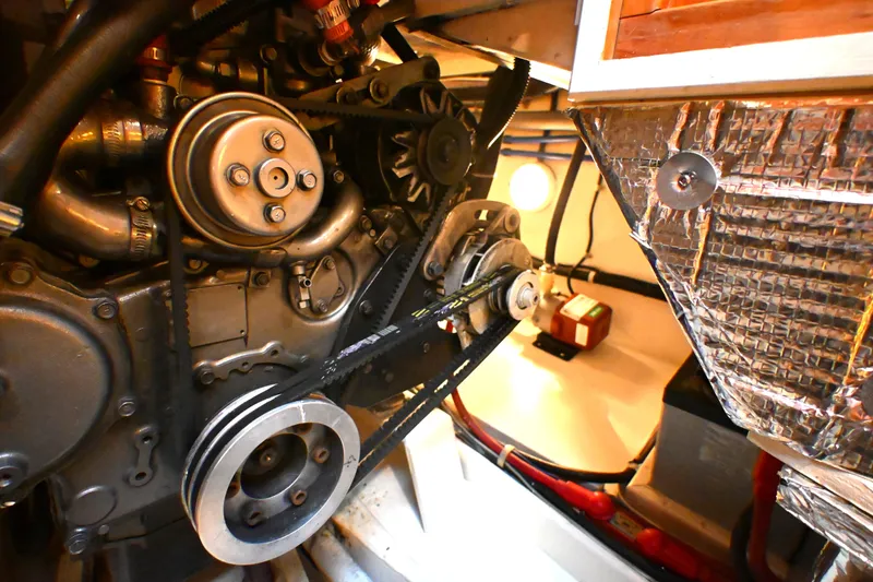 Slide: The Image of Engine compartment of a 2006 Waterline 50 yacht, showcasing belts and pulleys. - 76