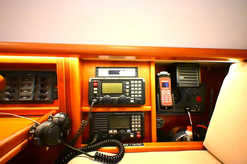 Slide: The Image of Navigation equipment on a 2006 Waterline 50 yacht, featuring radios and communication devices. - 79