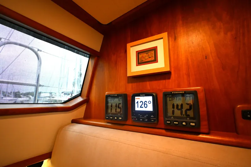 Slide: The Image of Interior of 2006 Waterline 50 yacht with navigation instruments and framed artwork. - 81