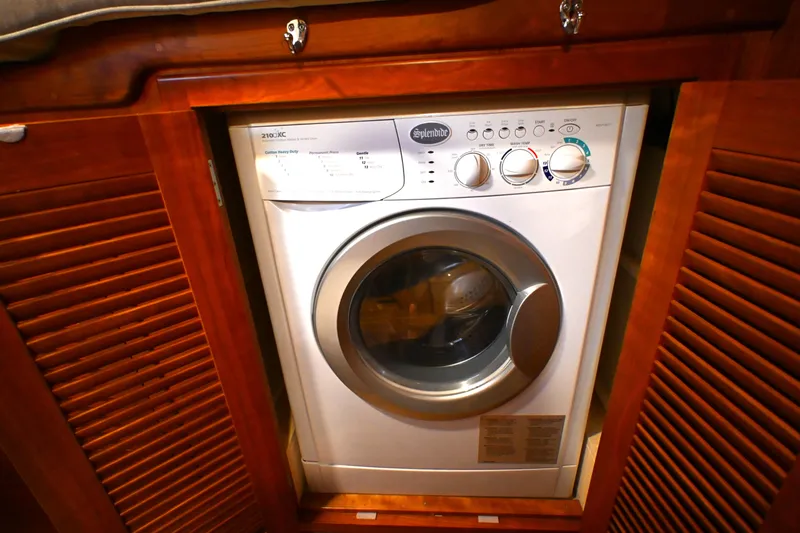Slide: The Image of Front-loading washing machine in wooden cabinet, Waterline 50, 2006 model. - 85