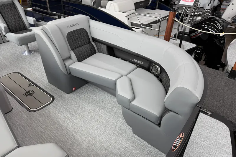 Slide: The Image of Luxurious seating on 2026 Harris Solstice 230 SLDH pontoon boat, featuring elegant gray upholstery. - 2