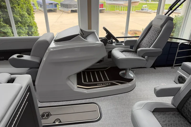 Slide: The Image of Luxurious interior of 2026 Harris Solstice 230 SLDH pontoon boat with modern seating and helm. - 4