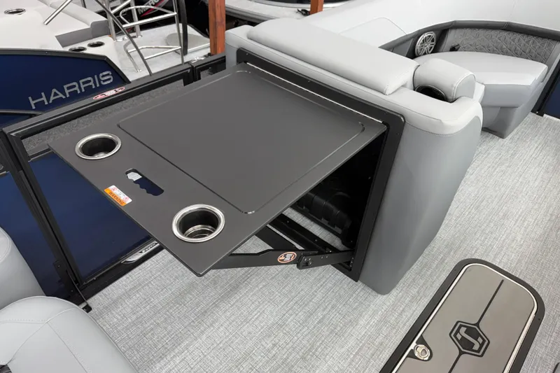 Slide: The Image of 2026 Harris Solstice 230 SLDH boat interior with foldable table and cup holders. - 6