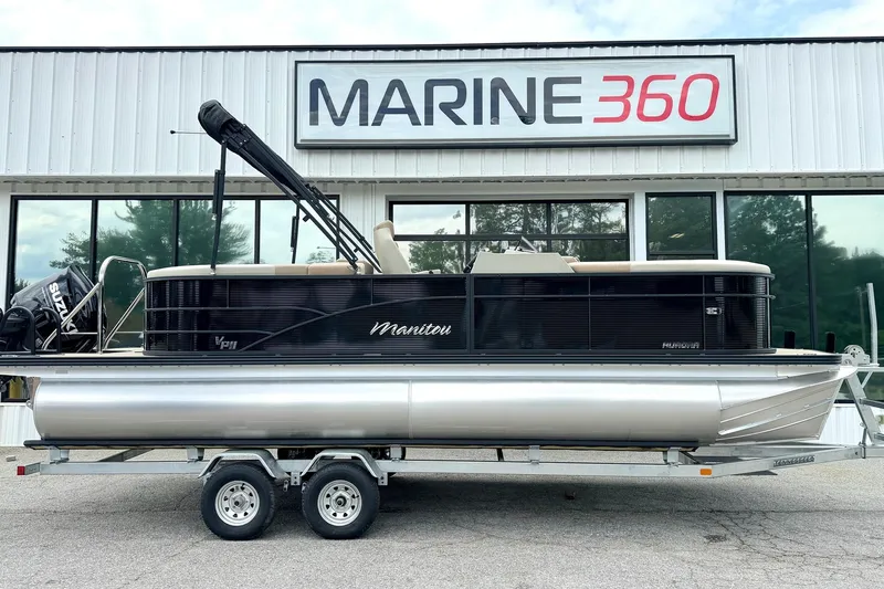 The Image of 2026 Manitou Aurora RF 23 pontoon boat on trailer at Marine 360 dealership. - 1