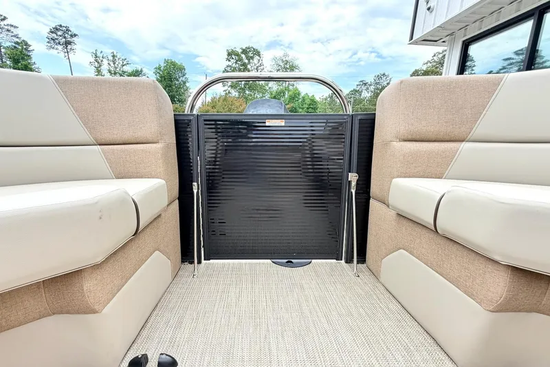 Slide: The Image of 2026 Manitou Aurora RF 23 interior with beige seating and sleek design. - 13