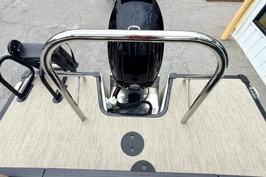 Slide: The Image of 2026 Manitou Aurora RF 23 boat deck with motor and railing, top view. - 14