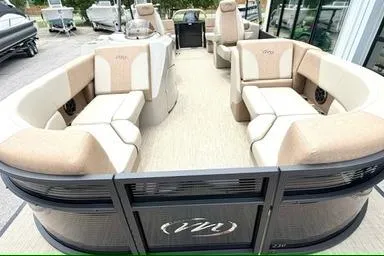 Slide: The Image of 2026 Manitou Aurora RF 23 pontoon boat with spacious seating and modern design. - 5