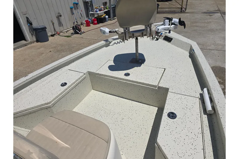 Slide: The Image of 2016 Xpress H20B Bay boat interior with seating and storage compartments. - 11