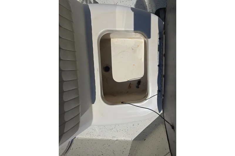Slide: The Image of 2016 Xpress H20B Bay boat storage compartment, open and empty. - 13