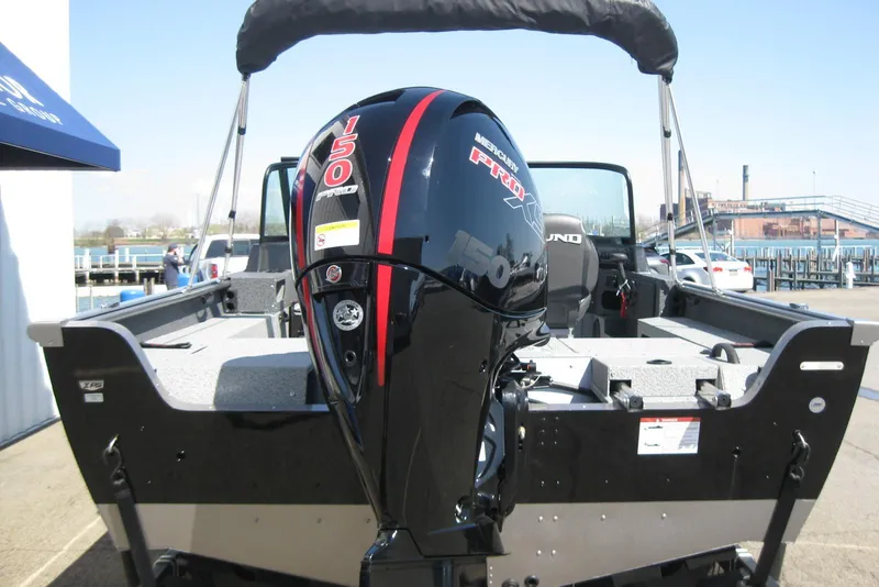 Slide: The Image of 2026 Lund 1875 Impact XS Sport boat with Mercury 150 Pro XS outboard motor. - 14