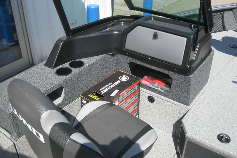 Slide: The Image of 2026 Lund 1875 Impact XS Sport boat interior with seating and storage compartments. - 19