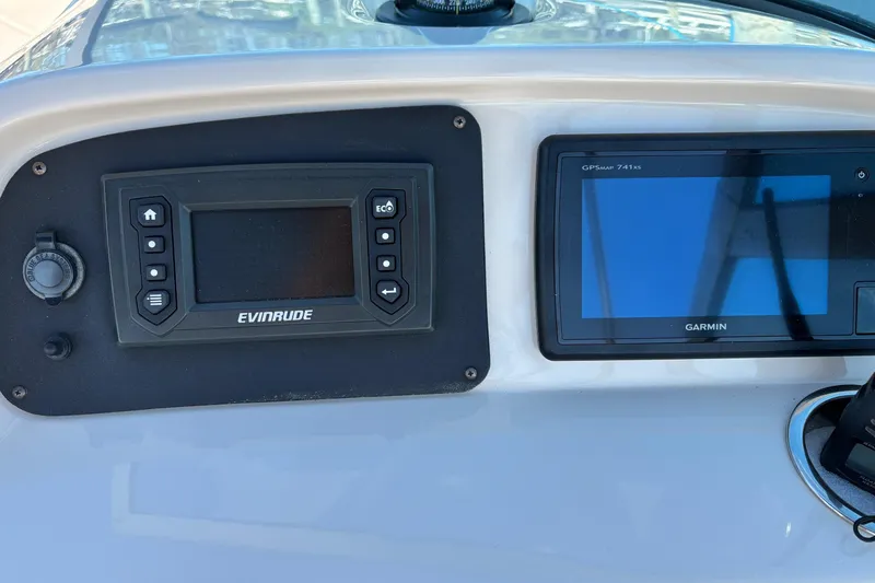 Slide: The Image of Dashboard of a 2017 Robalo R227 Dual Console with Evinrude and Garmin displays. - 12