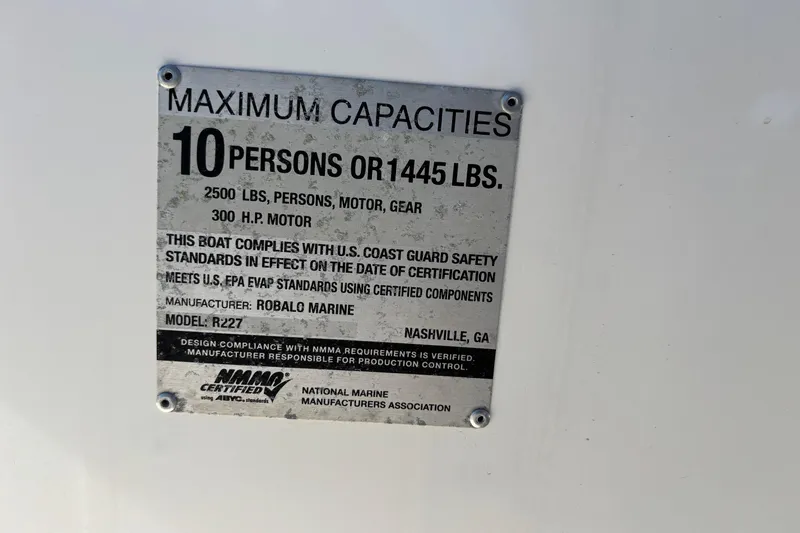 Slide: The Image of 2017 Robalo R227 Dual Console capacity plate, 10 persons or 1445 lbs, 300 HP motor. - 21
