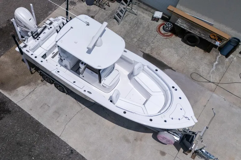 Slide: The Image of 2023 Sportsman Heritage 261 Center Console boat on trailer, viewed from above. - 101