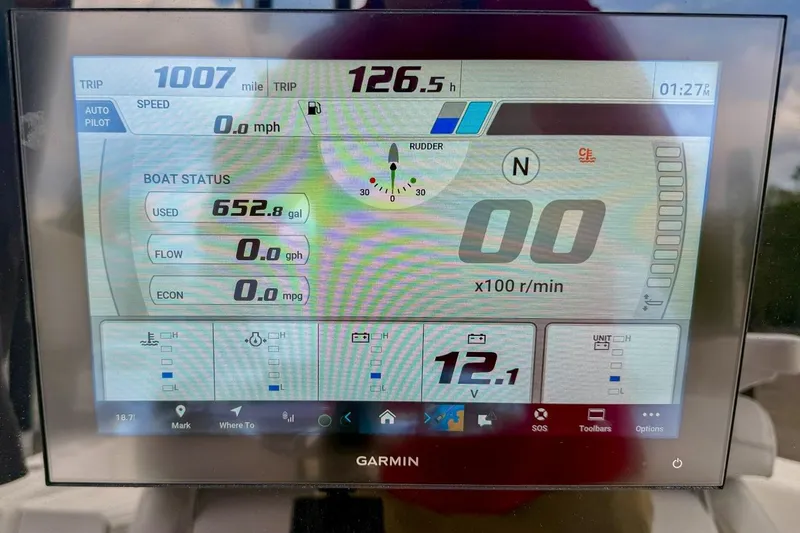 Slide: The Image of Touchscreen control panel on a 2023 Sportsman Heritage 261 Center Console boat. - 11