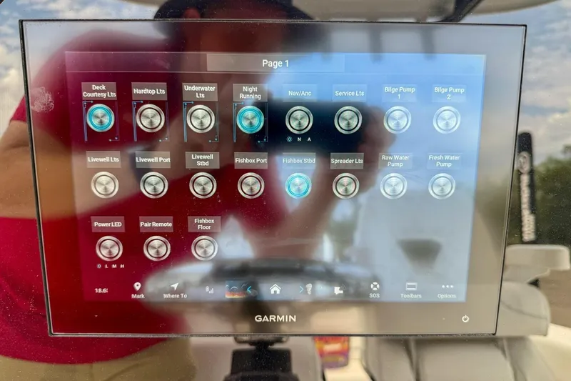 Slide: The Image of 2023 Sportsman Heritage 261 Center Console controls with Lectrotab trim tab panel. - 12