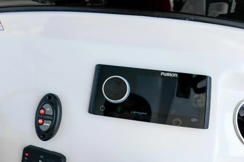 Slide: The Image of Compass on 2023 Sportsman Heritage 261 Center Console boat dashboard. - 14