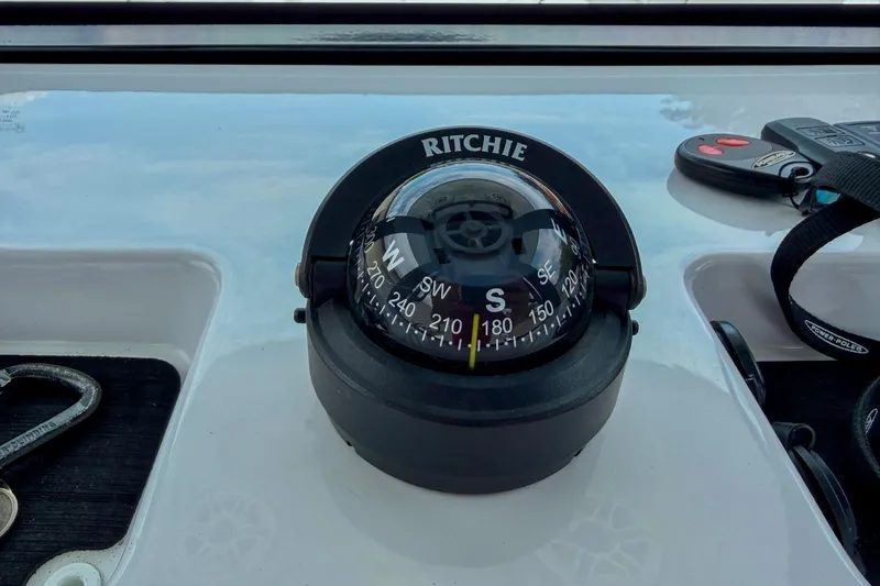 Slide: The Image of Remote controls for 2023 Sportsman Heritage 261 Center Console boat, featuring Power-Pole and Yamaha keys. - 15