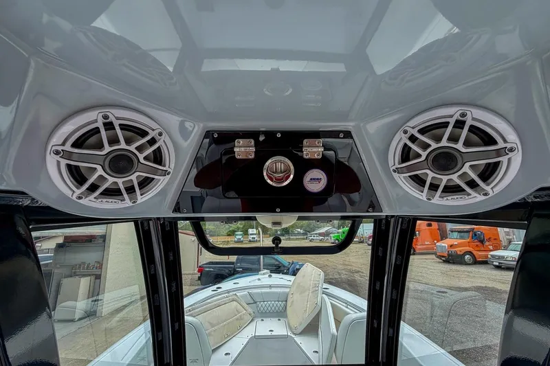 Slide: The Image of 2023 Sportsman Heritage 261 Center Console boat with spacious seating and modern design. - 18