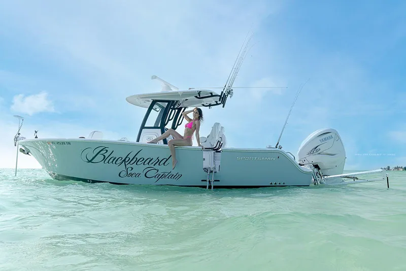 Slide: The Image of 2023 Sportsman Heritage 261 Center Console on the water. - 2