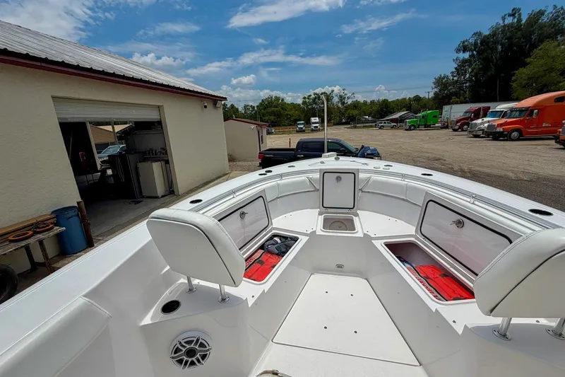Slide: The Image of 2023 Sportsman Heritage 261 Center Console boat with spacious seating and modern design. - 20
