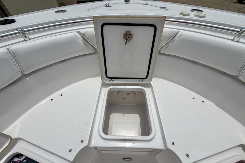 Slide: The Image of Storage compartment on 2023 Sportsman Heritage 261 Center Console with life jackets and supplies. - 29
