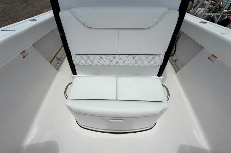 Slide: The Image of Open storage compartment on 2023 Sportsman Heritage 261 Center Console boat. - 33