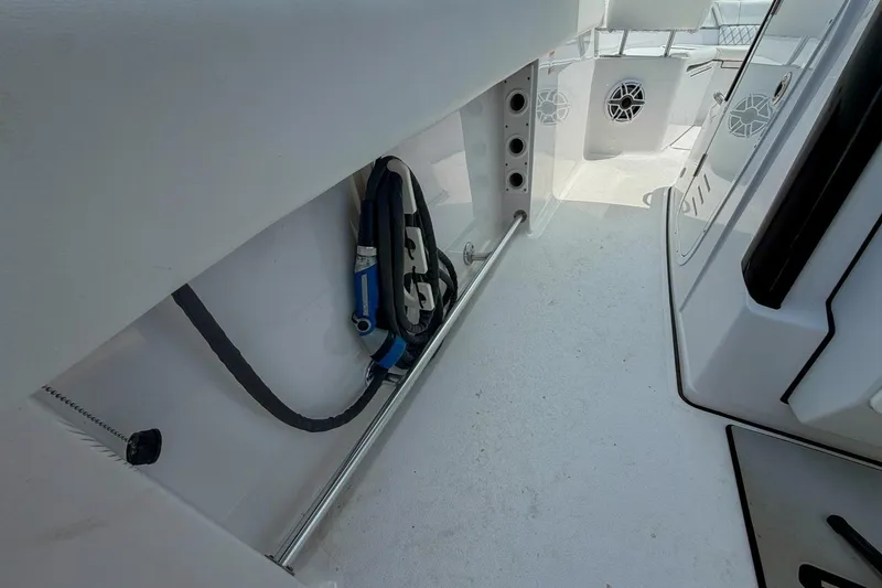 Slide: The Image of 2023 Sportsman Heritage 261 Center Console boat interior with seating and storage compartments. - 35