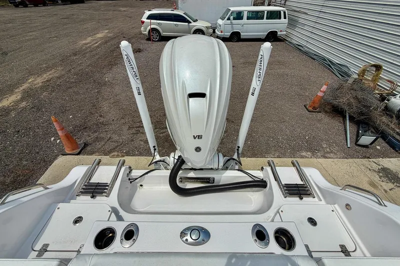 Slide: The Image of 2023 Sportsman Heritage 261 Center Console with Yamaha V8 engine, docked outdoors. - 45